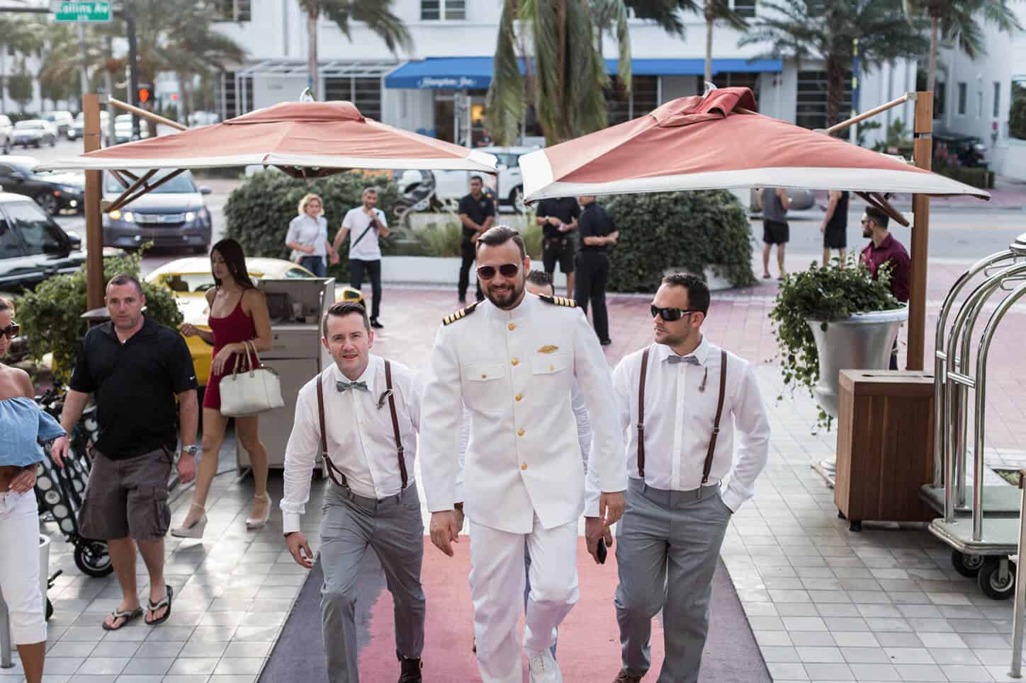 Groom & Groomsmen walking to wedding ceremony at SLS Hotel South Beach | Miami Beach Wedding Photographer