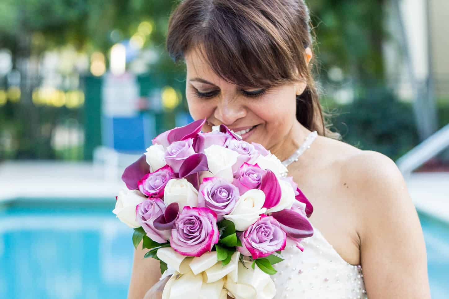 Featured photo of bride holding floral bouquet | By wedding vendor White House Wedding Photography