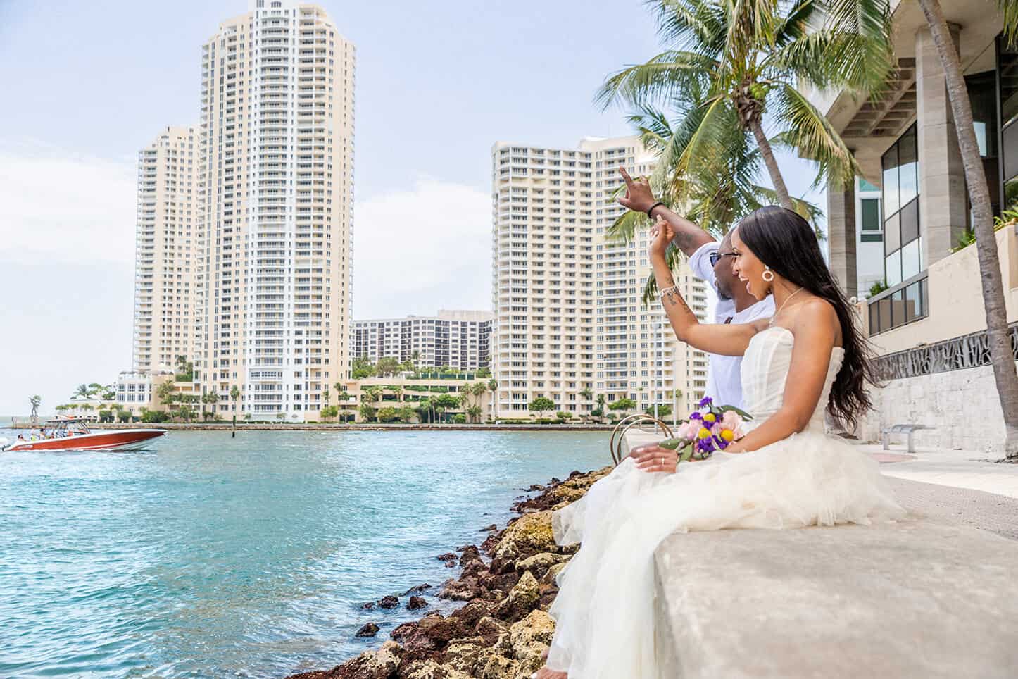 Newlywed Couple Waiving at Boat | Destination Weddings Miami