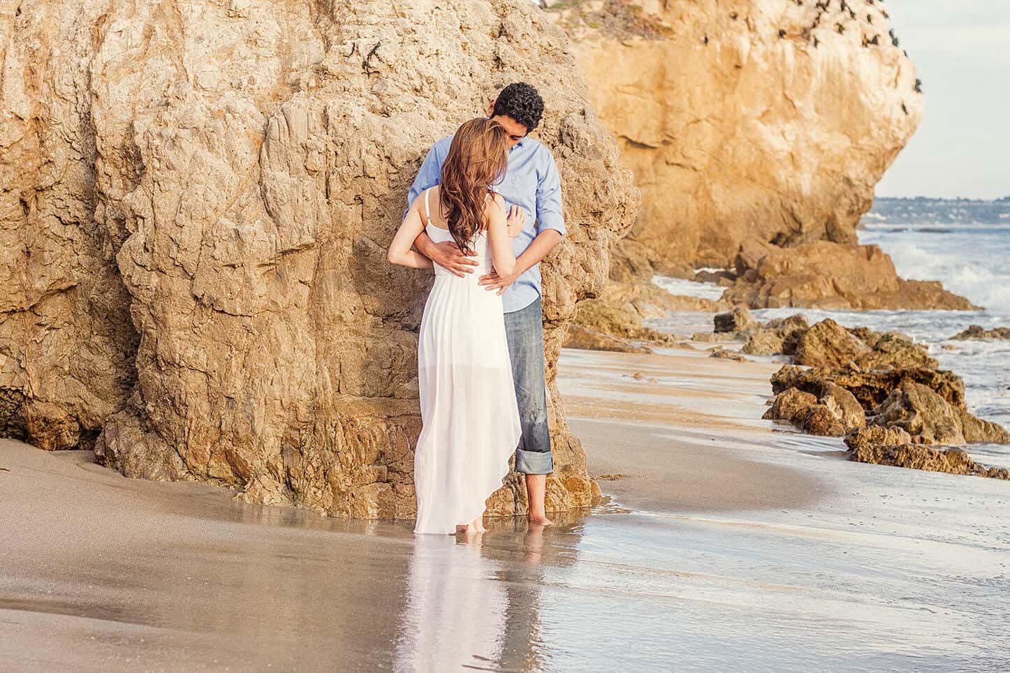 Photo of a couple kissing on the beach in Malibu, CA | White House Wedding Photography
