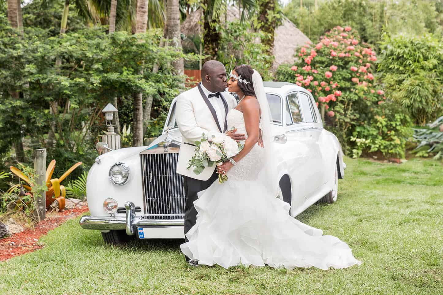 First Look Photo of couple in front of a vintage Rolls Royce at Bamboo Gallery Venue: For Blog Post Wedding Photographer Cost in 2025
