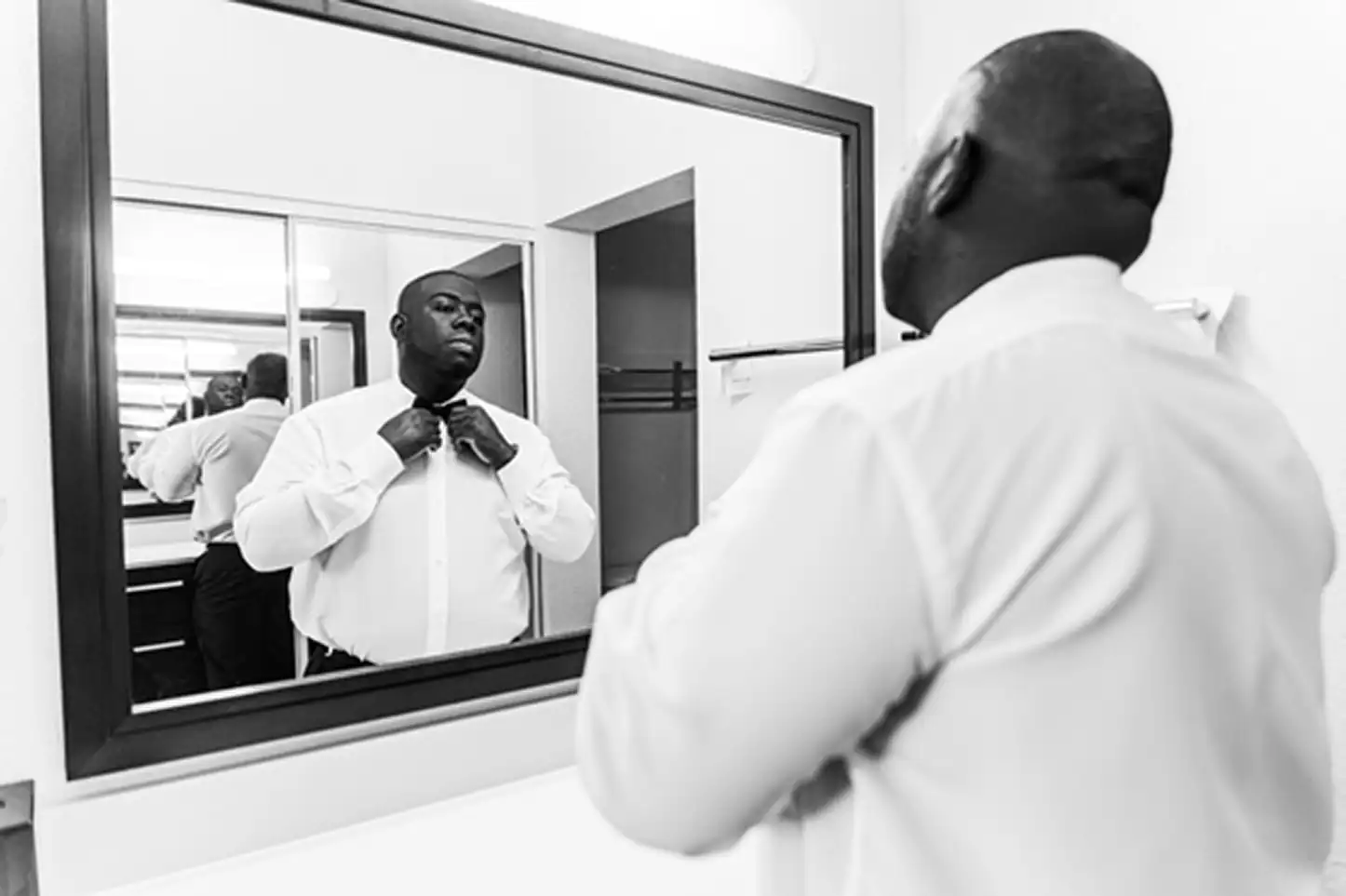 Groom preparing for his wedding day at the Residence Inn Fort Lauderdale before a beautiful Bamboo Gallery wedding.