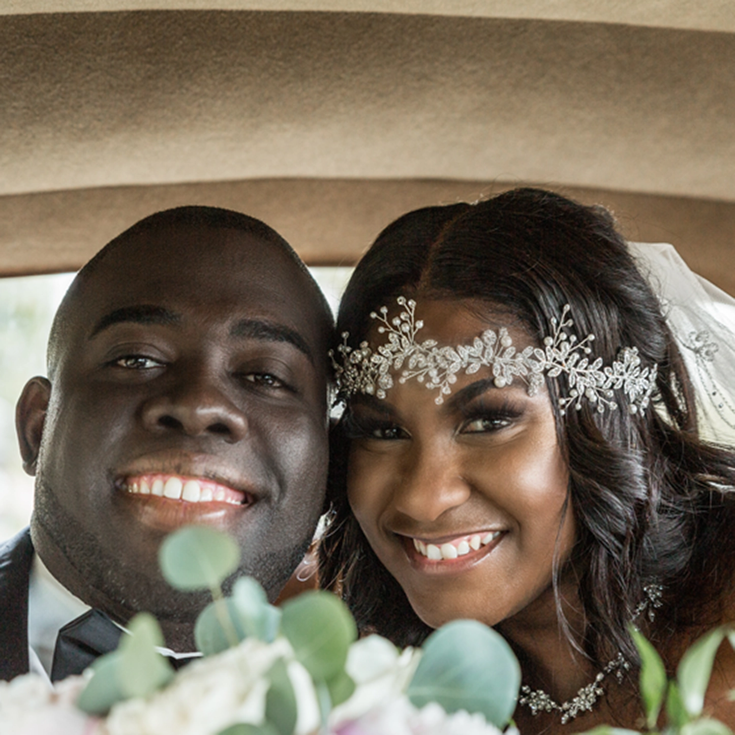 Bride and groom pose inside and beside a classic vintage Rolls-Royce at the Bamboo Gallery wedding venue in Davie, Florida.