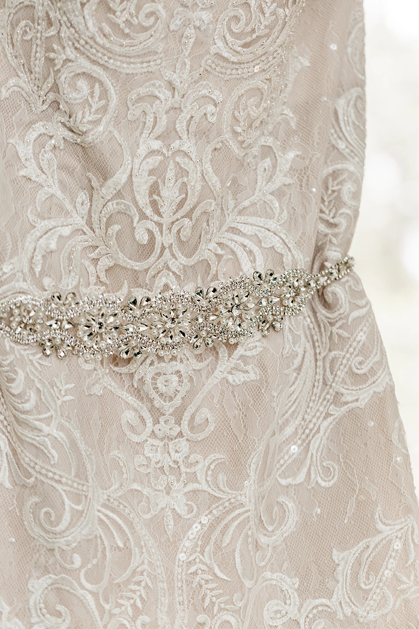 Detail shot of a wedding dress hanging before a Bamboo Gallery wedding in Fort Lauderdale