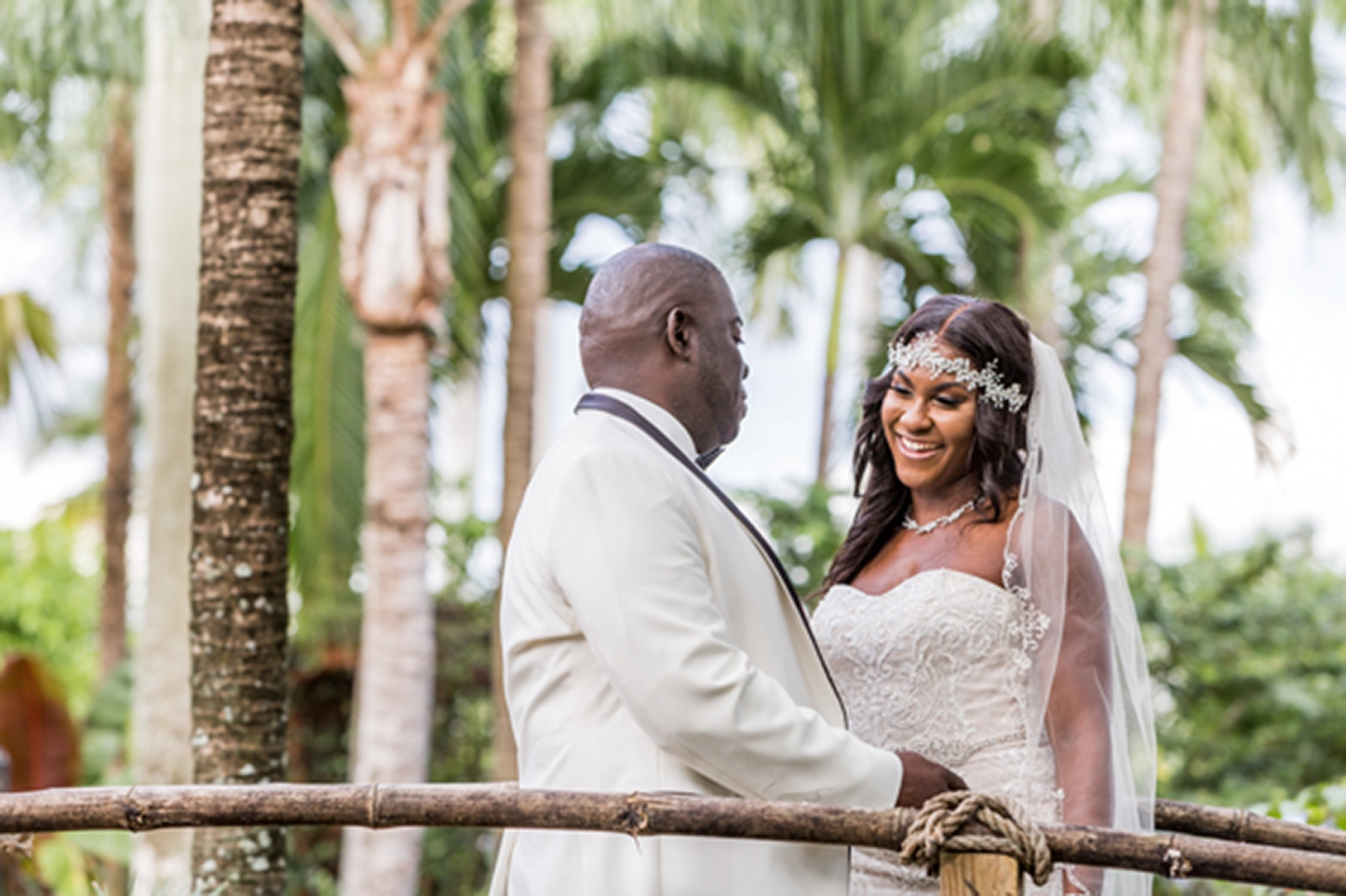 Bride and groom share an emotional first look at the lush Bamboo Gallery wedding venue in Davie, Florida.