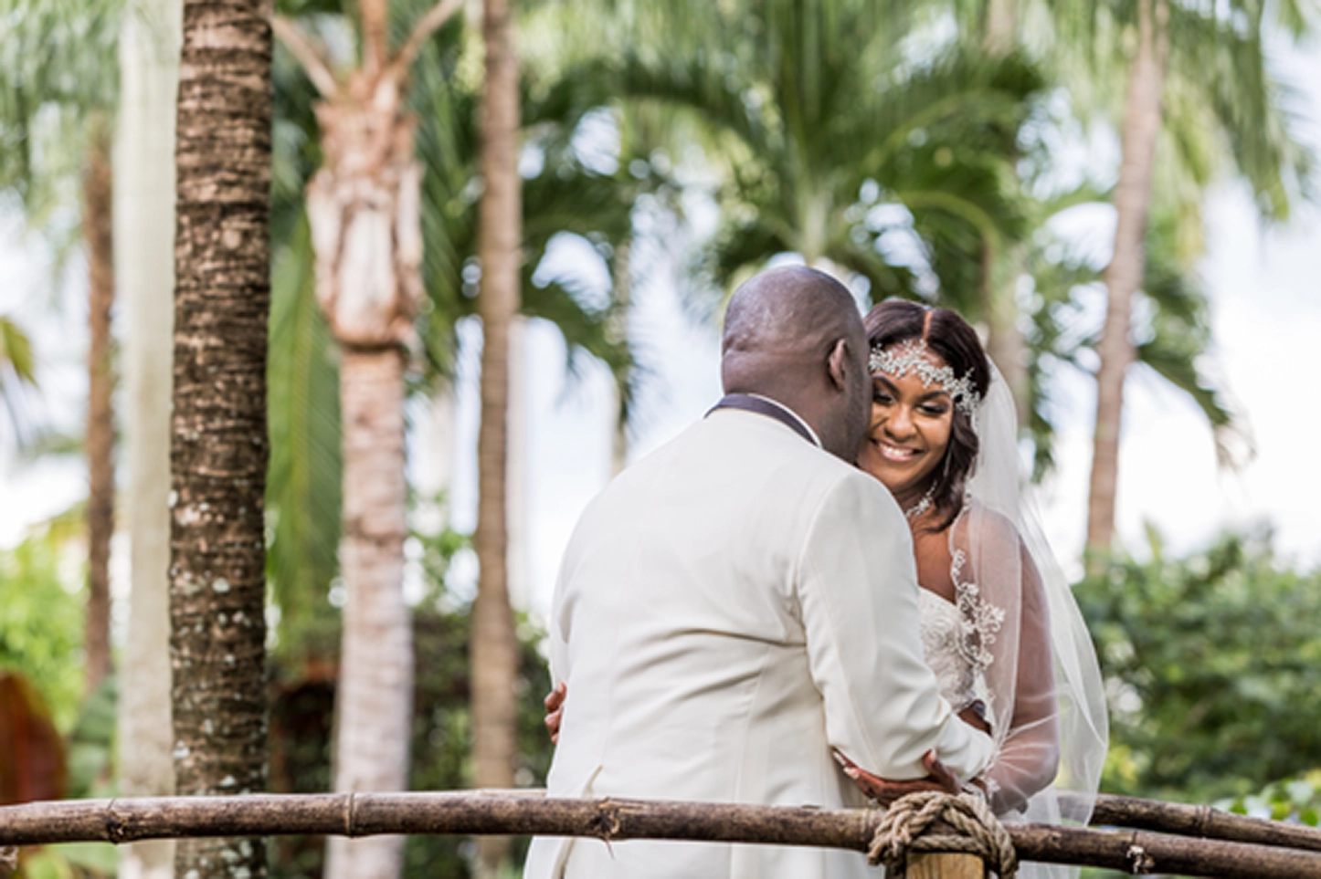 Bride and groom share an emotional first look at the lush Bamboo Gallery wedding venue in Davie, Florida.