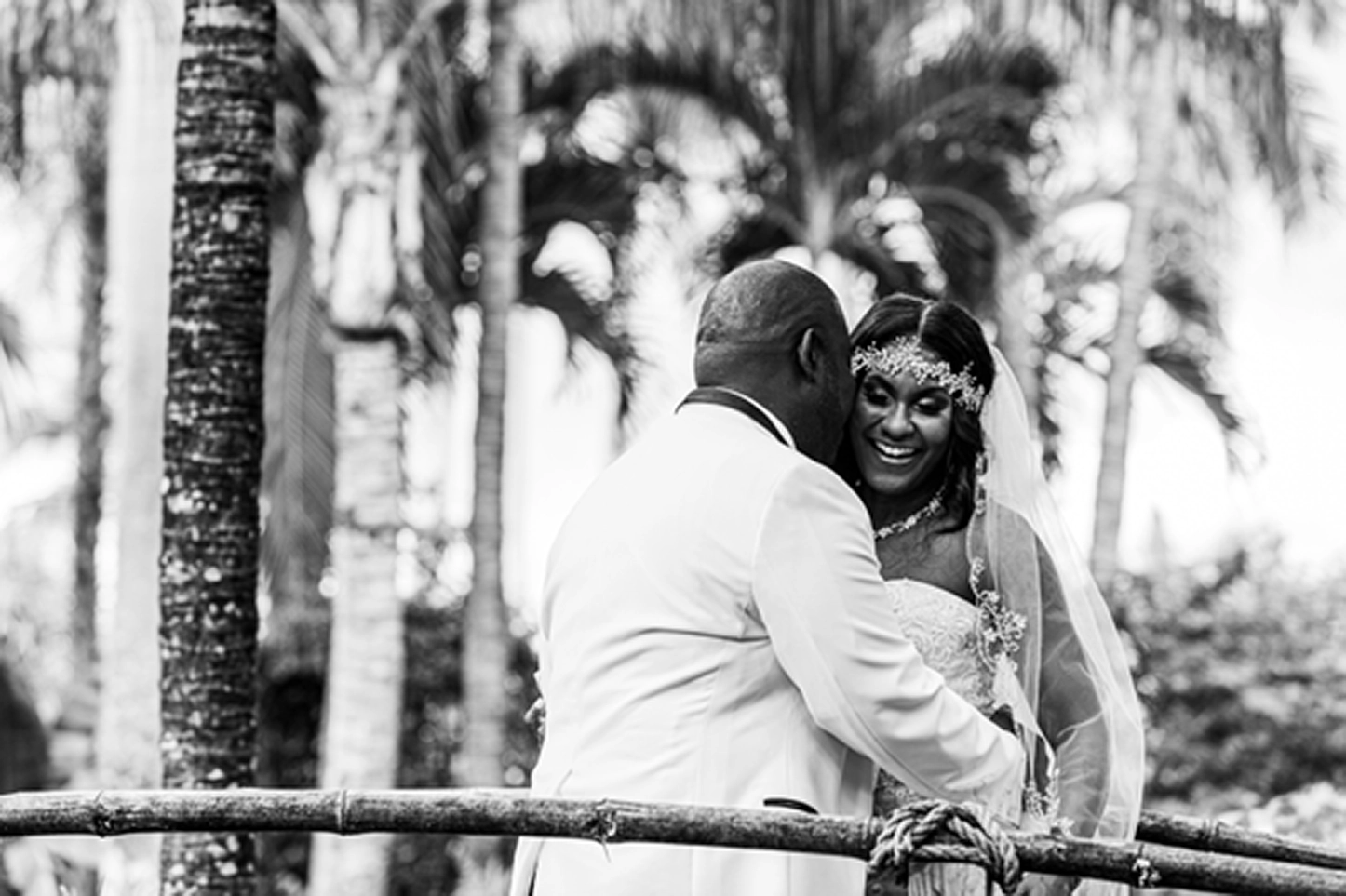 Bride and groom share an emotional first look at the lush Bamboo Gallery wedding venue in Davie, Florida.