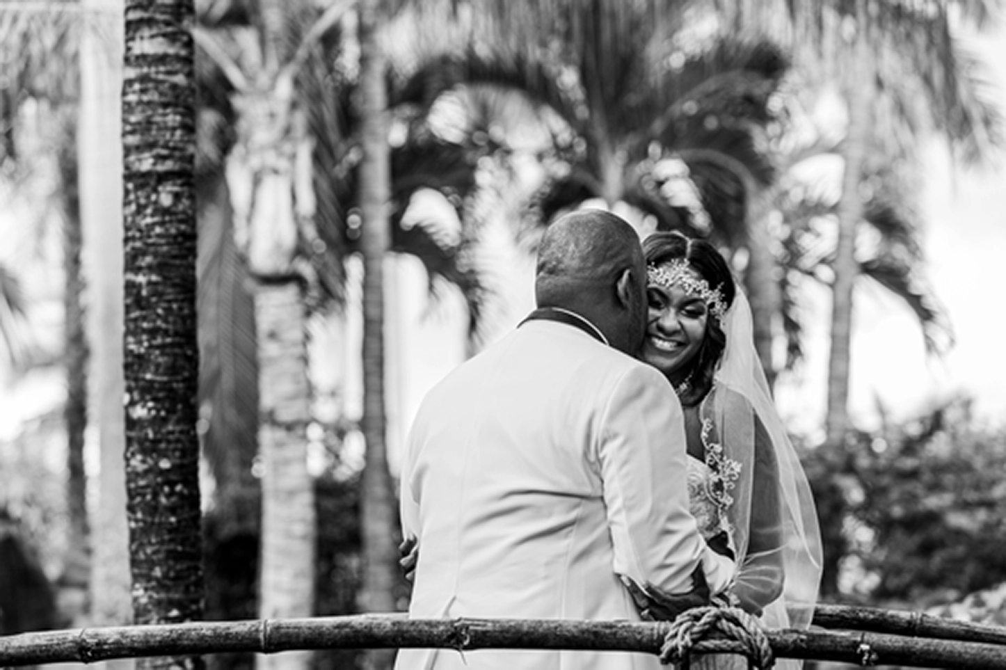 Bride and groom share an emotional first look at the lush Bamboo Gallery wedding venue in Davie, Florida.
