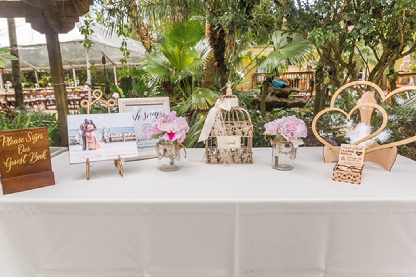 Detail shot of guests’ welcome table decorated for a Bamboo Gallery wedding in Davie, South Florida