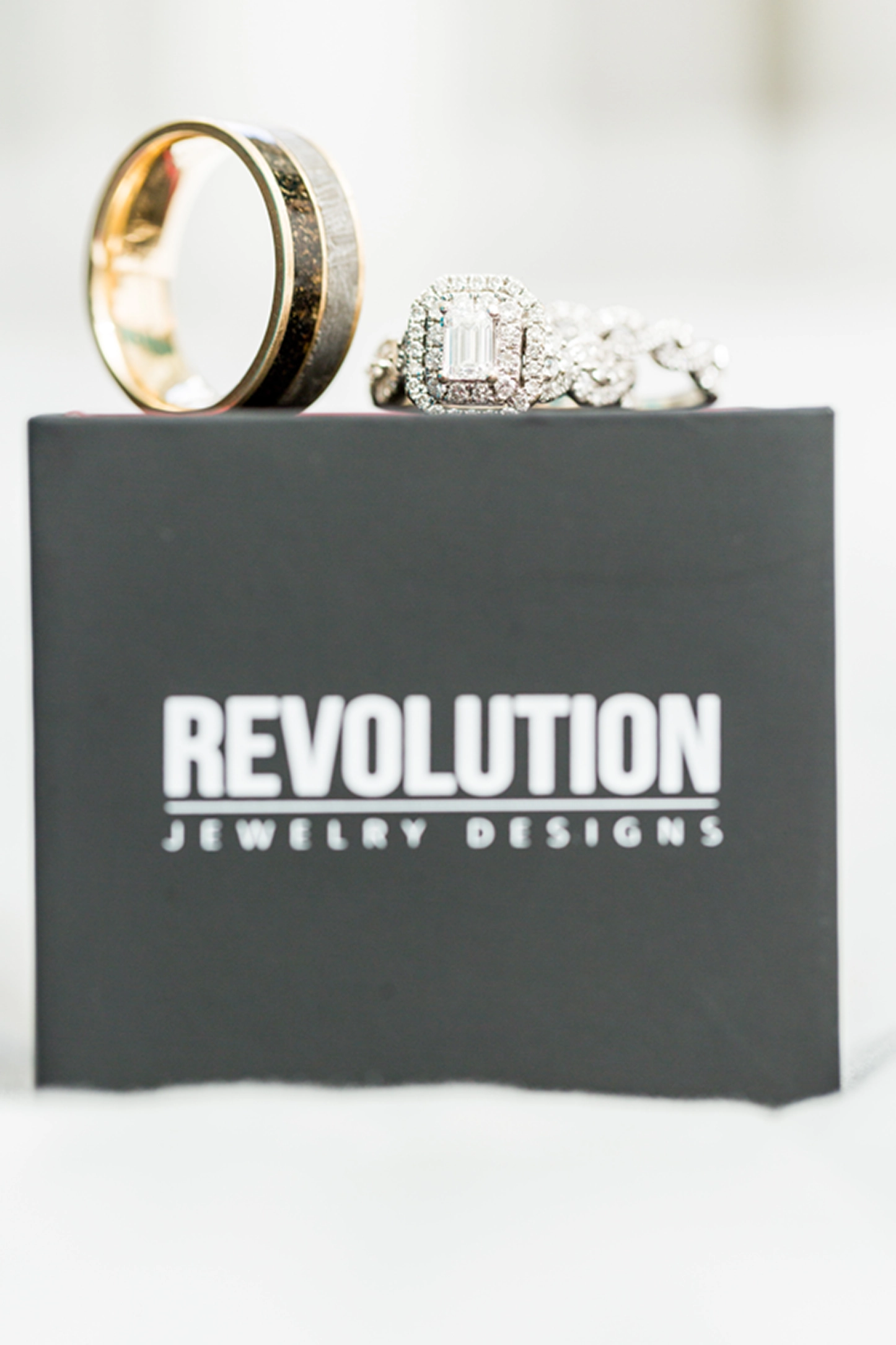 Close-up of wedding bands and engagement ring from Revolution Jewelry Designs at a Fort Lauderdale wedding