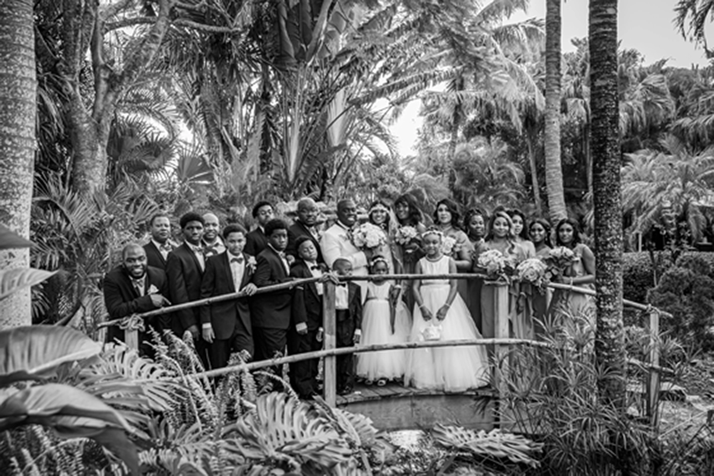 Bride, groom, and wedding party celebrating at the Bamboo Gallery wedding venue in Davie, Florida.