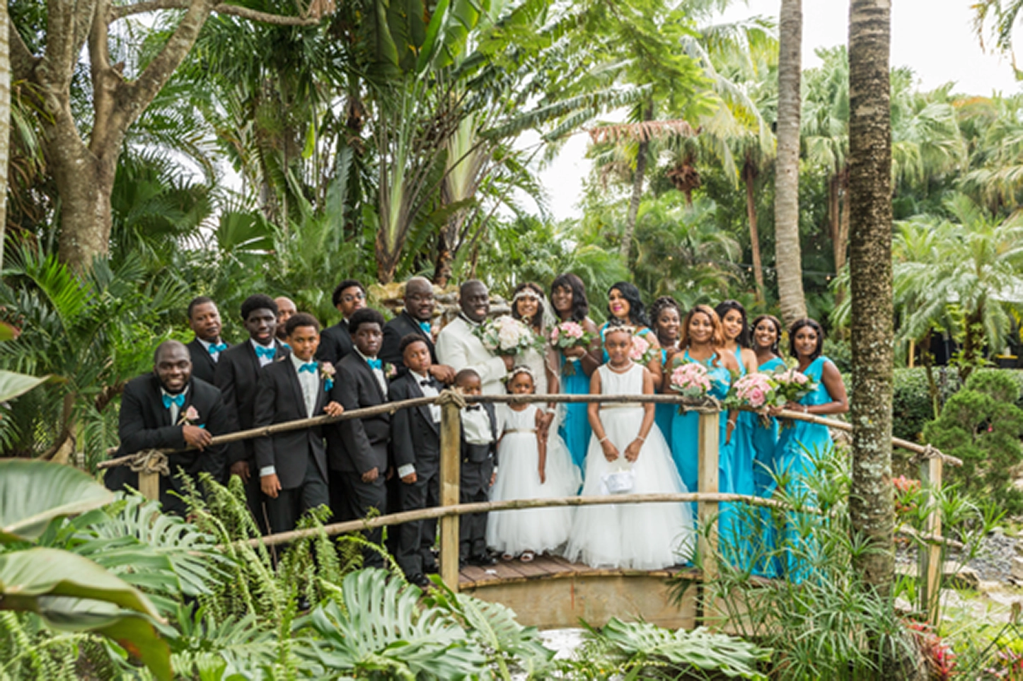 Bride, groom, and wedding party celebrating at the Bamboo Gallery wedding venue in Davie, Florida.